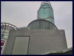 Nanfang International Mansion, a 48-storey hotel built in 1998 with a green glass exterior.  With a height of 201m to the spire, this was the second tallest building in Guangzhou upon completion.